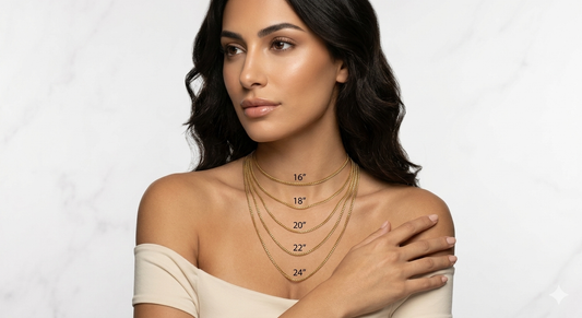 A woman wearing multiple chains to show difference in sizes, starting from sixteen inches, eighteen inch, twenty inch, twenty two in, twenty four inches in length