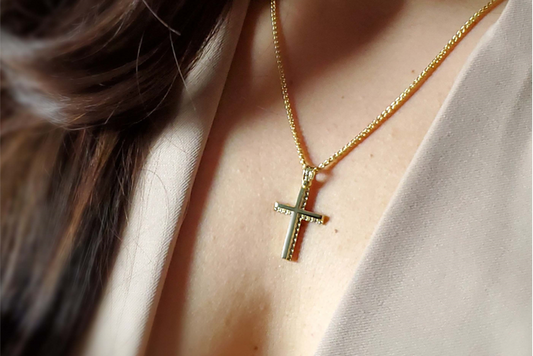 woman wearing a religious cross suspended on a chain