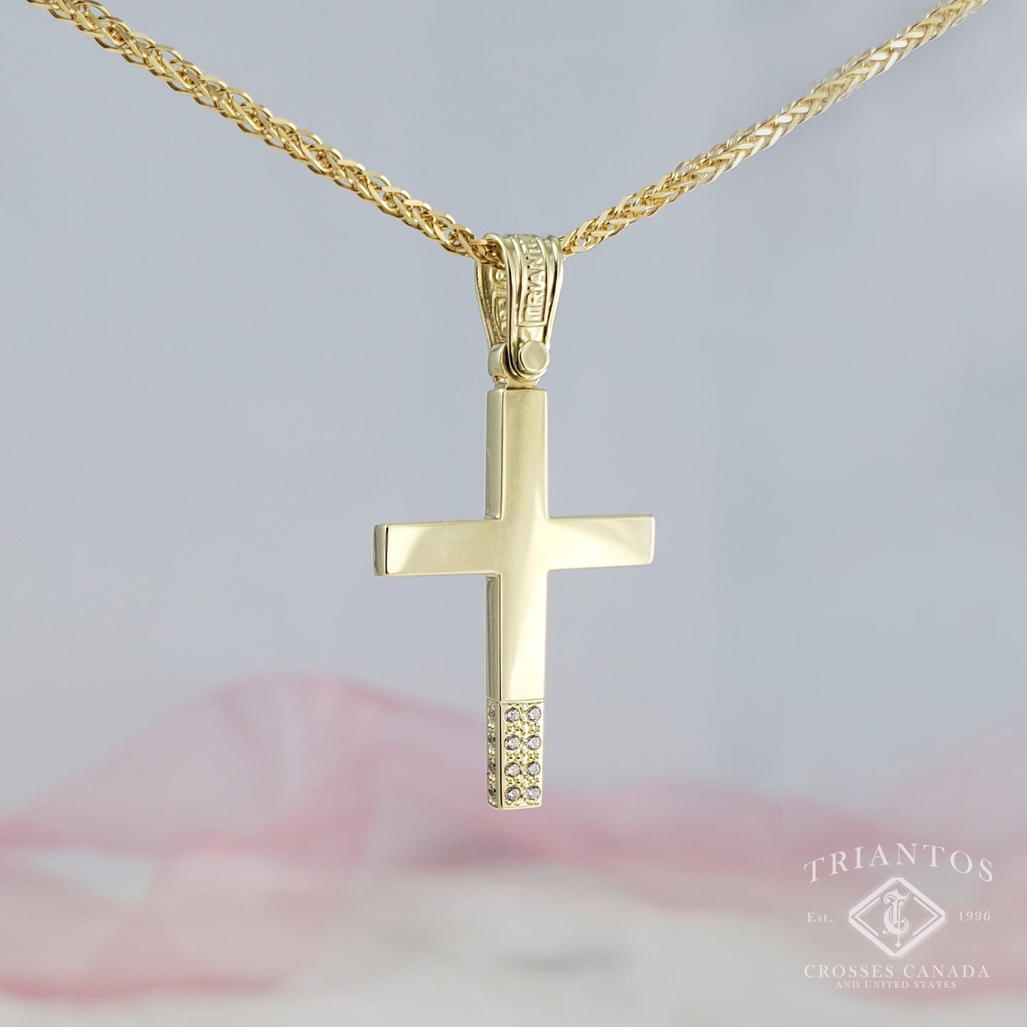 Modern Cross with a total of 16 sparkling Cubic Zirconia Stones on the bottom center and sides