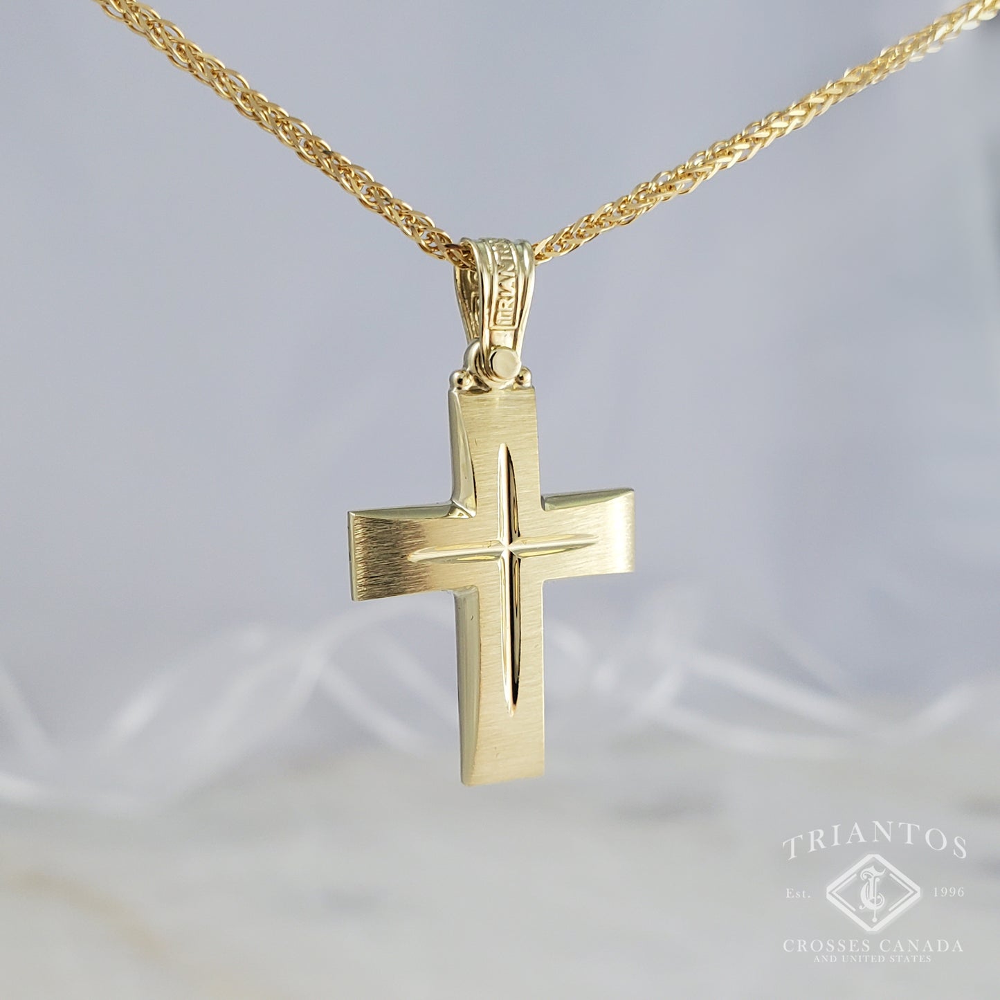 Solid Triantos 14K Gold Orthodox Christian cross with brush-stroke like finish. In the middle a Chiseled Polish Cross for design in white gold.
